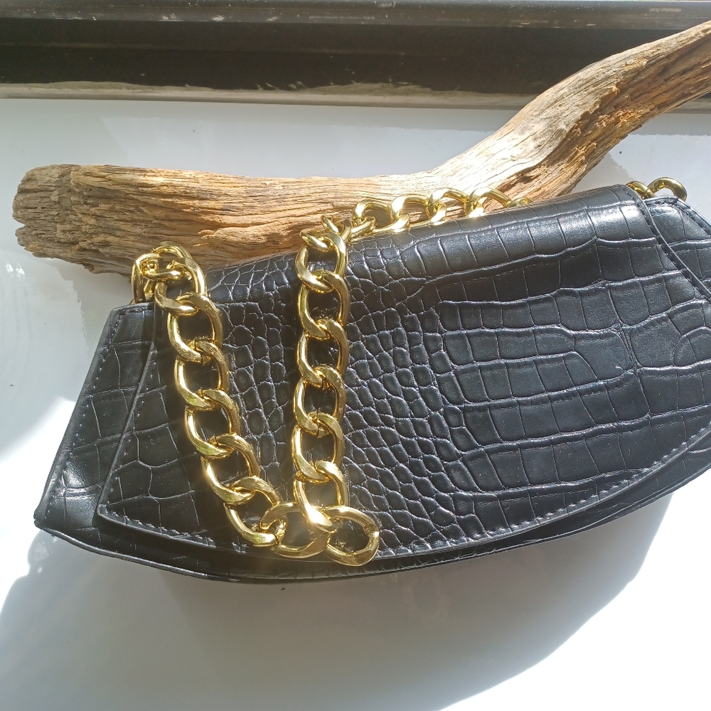 Black leather evening bag with large gold color chain
